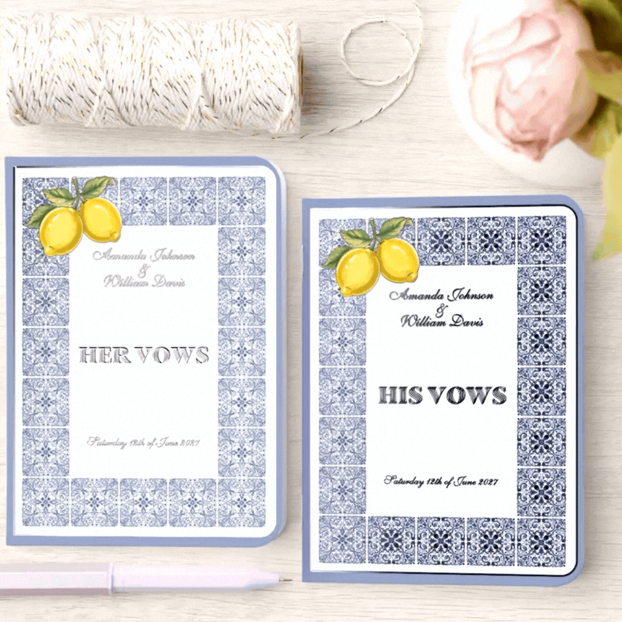 Animated view of the His & Her Amalfi Coast–inspired wedding vow books, showcasing shimmering silver foil details as they catch the light. The reflective His Vows and Her Vows typography, along with delicate silver accents in the lemon illustrations and blue tile patterns, gently glimmer with movement, emphasizing the refined, luminous finish and elegant Mediterranean design.